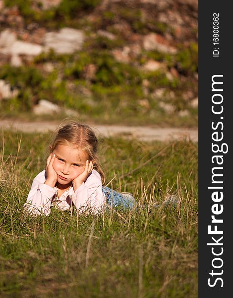 Beautiful girl  lying on the grass