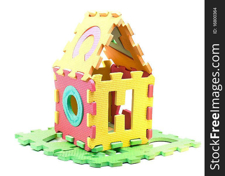 Toy house made of multicolored puzzle