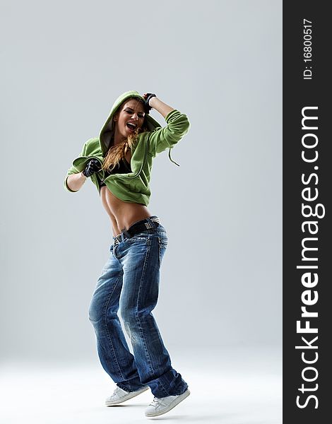 Modern style dancer posing on studio background. Modern style dancer posing on studio background