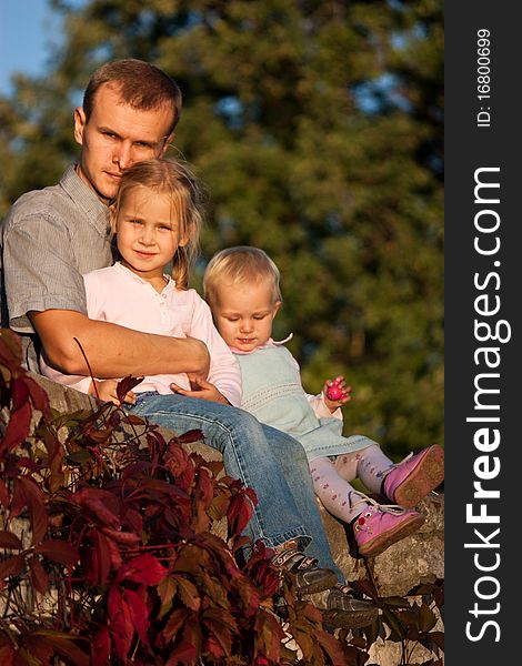 Father with two daughters playing in summer. Father with two daughters playing in summer