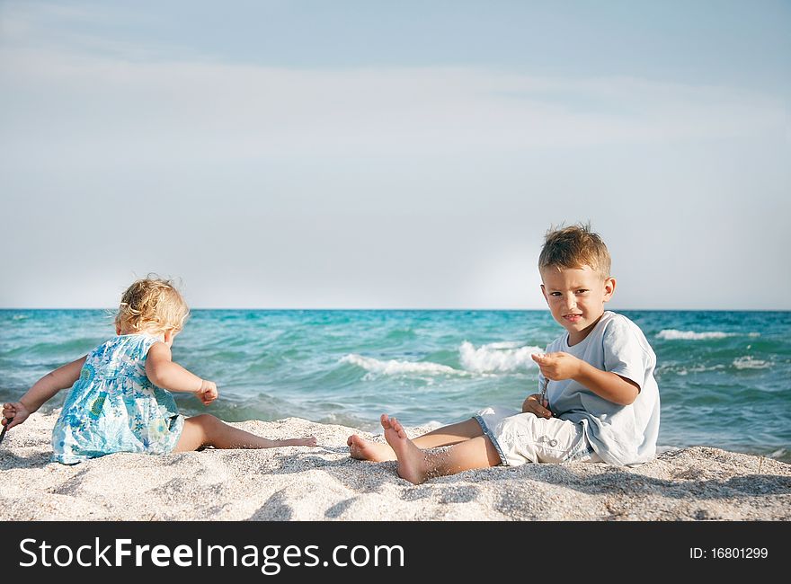 Two children playing on beach