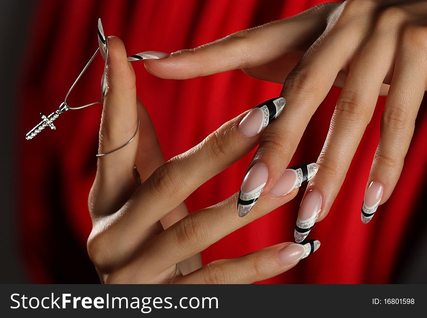 Beautiful hands and nails on a red background