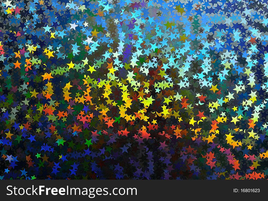 Enlarged fragment of an abstract background with multicolored stars. Enlarged fragment of an abstract background with multicolored stars.