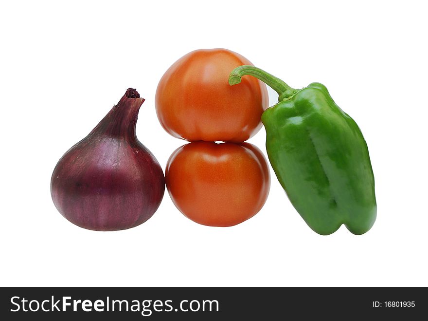 Multi-coloured vegetables on a white background. Multi-coloured vegetables on a white background