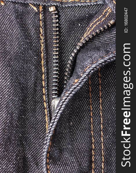 Closeup view of opened zipper on jeans.