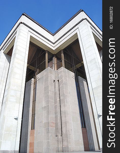 Corner of a building against the blue sky