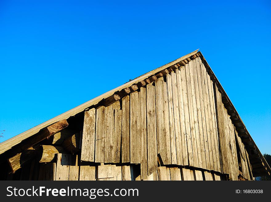 Old roof against the blue sky