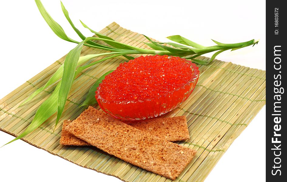 Glass flat dish filled with tasty red brilliant caviar. Glass flat dish filled with tasty red brilliant caviar