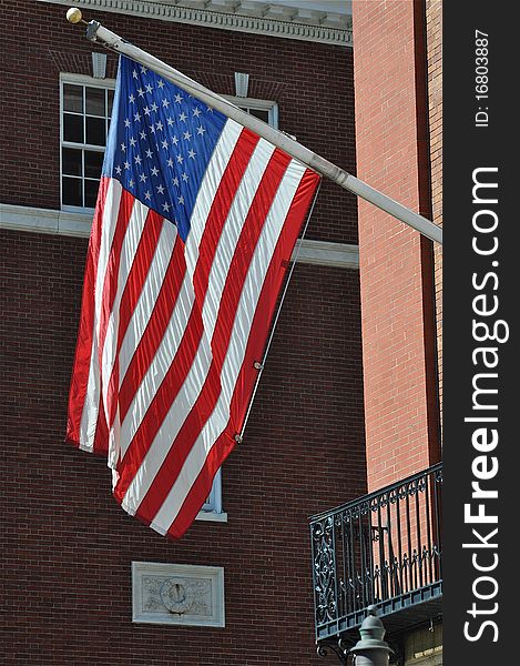 An American Flag located in Boston, Massachusetts, a historical city. An American Flag located in Boston, Massachusetts, a historical city
