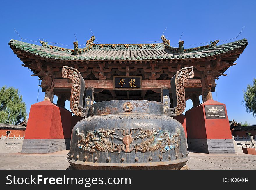 Old Chinese temple and featured censer for sacrifice rive, shown as traditional architecture style and historic feature. Old Chinese temple and featured censer for sacrifice rive, shown as traditional architecture style and historic feature.