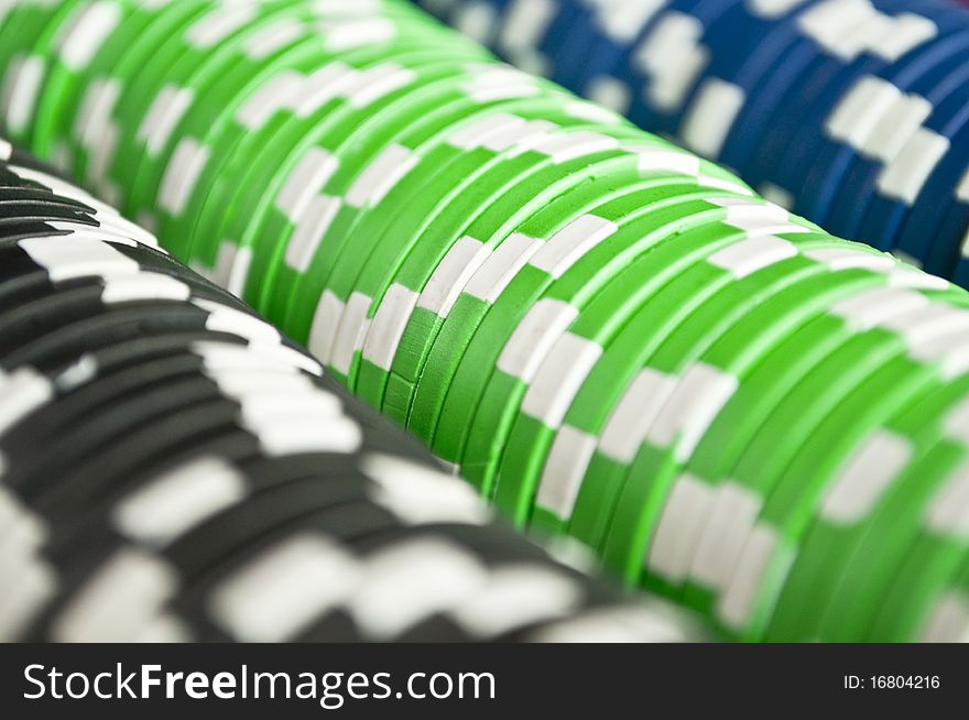 Casino gambling chips in three colors background