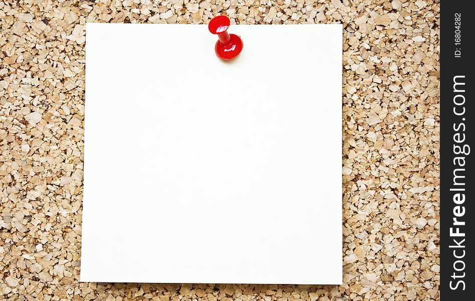 Blank paper note on cork board