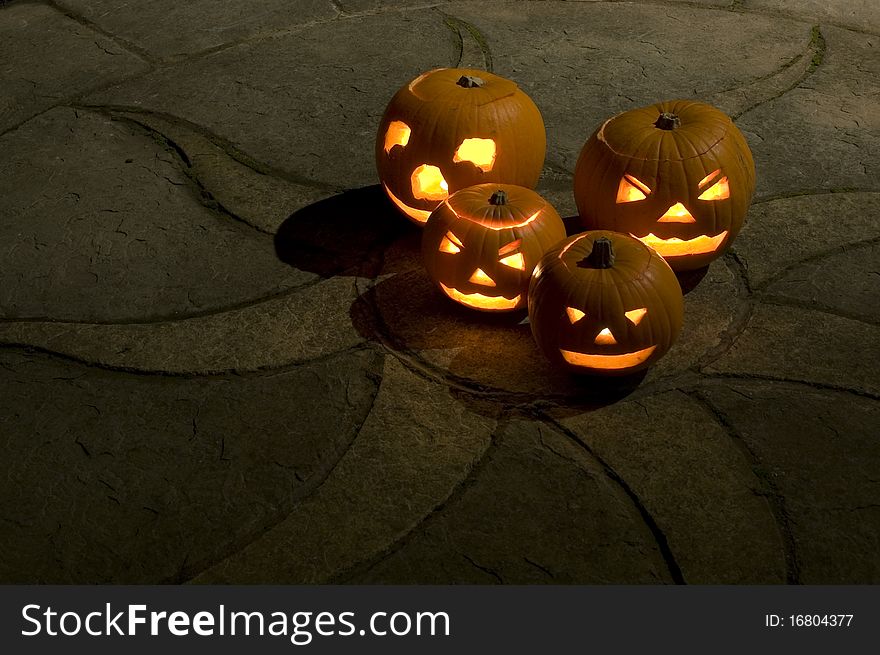 A group of Pumkins, Illuminated by candles & photographed at night. A group of Pumkins, Illuminated by candles & photographed at night