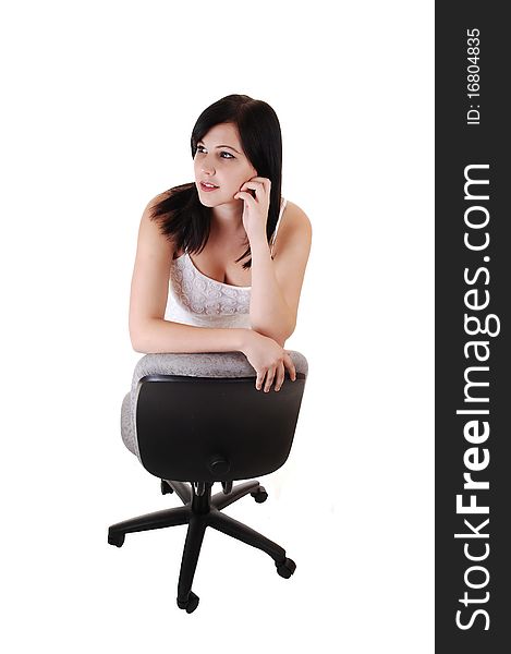 An young woman in a white dress standing in the studio for a portrait shot, smiling into the camera, for white background. An young woman in a white dress standing in the studio for a portrait shot, smiling into the camera, for white background.