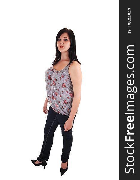 A young woman in jeans and a gray top standing in front of the camera and looking , for white background. A young woman in jeans and a gray top standing in front of the camera and looking , for white background.