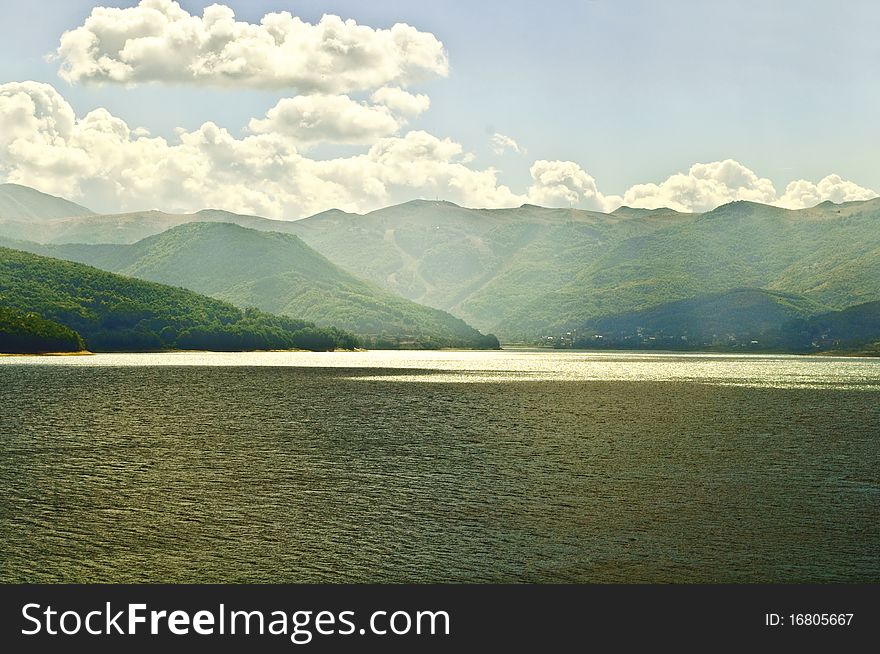 Landscape of lake and forest with sun rays. Landscape of lake and forest with sun rays