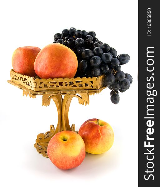 Fruits in woodem vase on white background