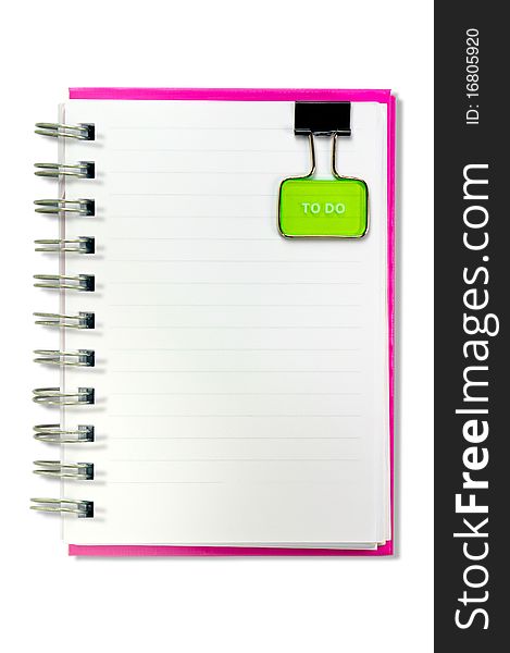 A blank notebook with a yellow clip . The clip is positioned in a top position. Isolated on a white background. A blank notebook with a yellow clip . The clip is positioned in a top position. Isolated on a white background.