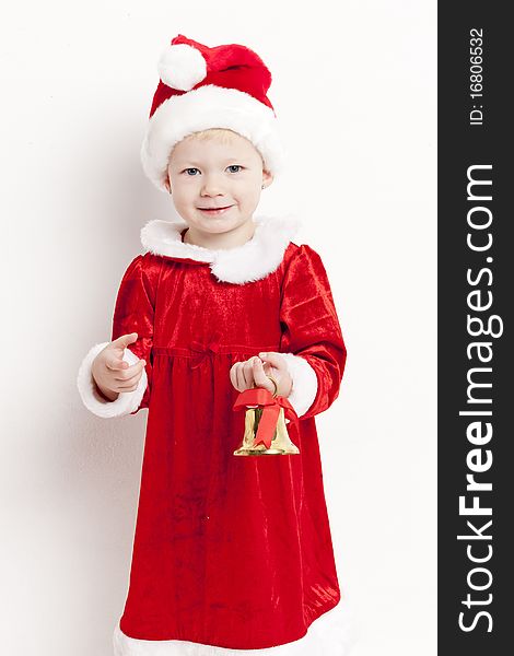Little girl as Santa Claus with a bell