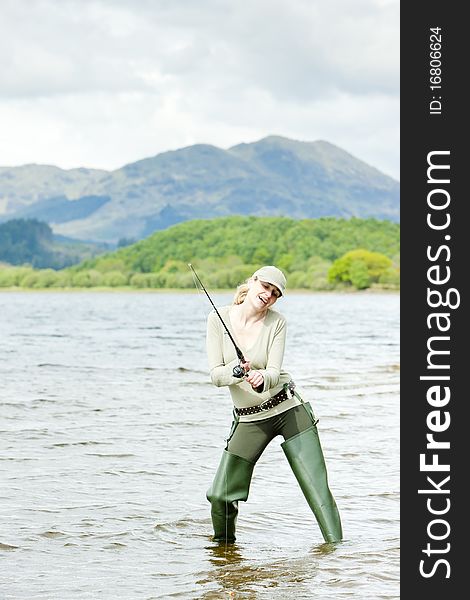 Fishing woman in Loch Venachar, Trossachs, Scotland. Fishing woman in Loch Venachar, Trossachs, Scotland