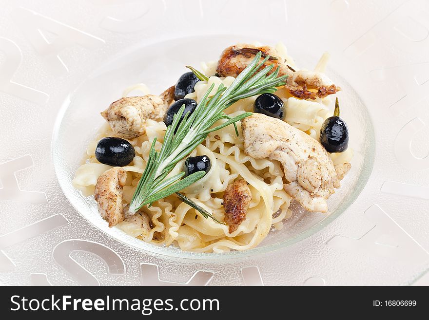 Pasta with turkey meat on rosemary