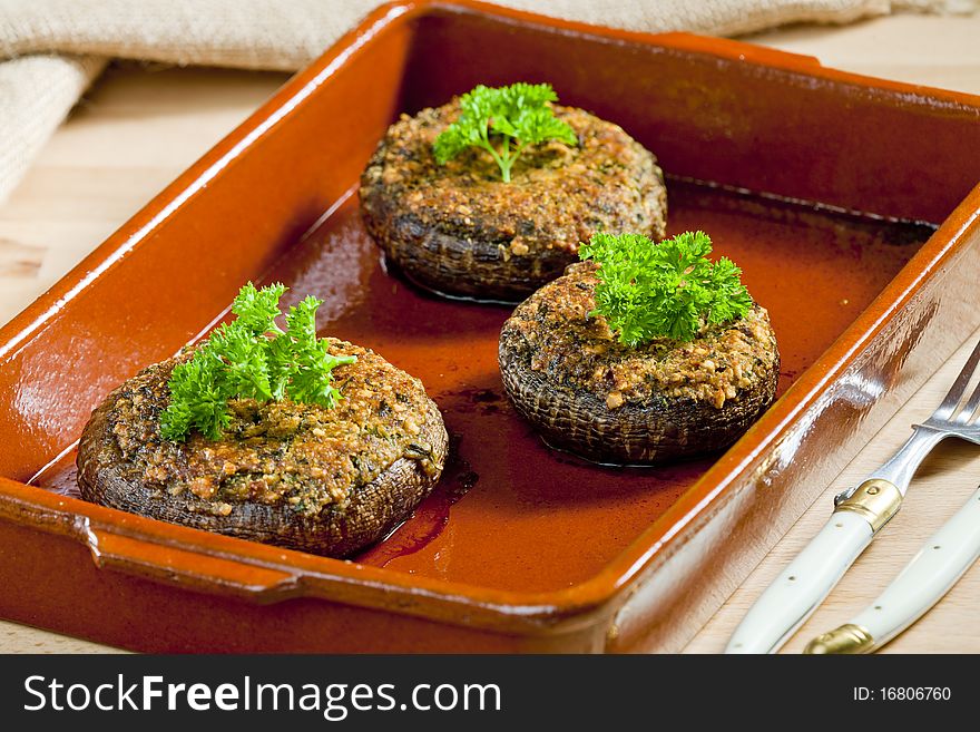 Baked champignons filled with peanuts mixture