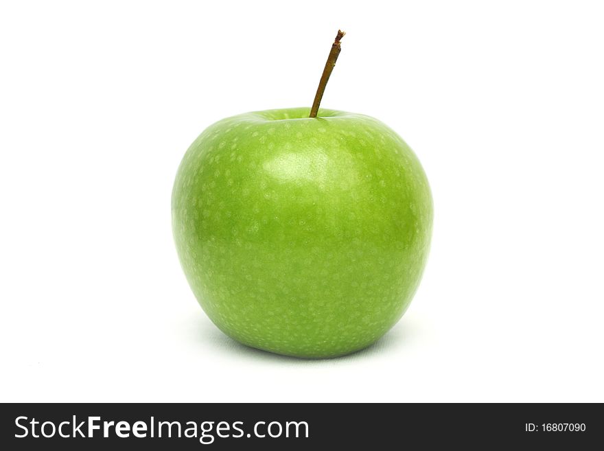 Close up of a green apple isolated on white background.