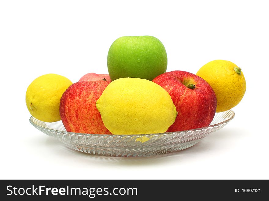 Close up of a pile of mixed fruits isolated over white background.