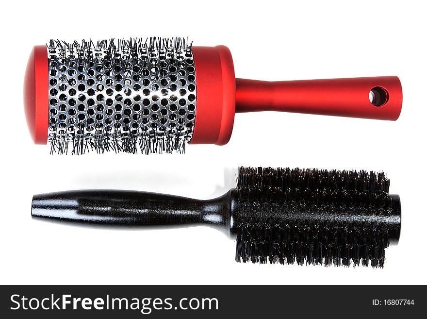 Two red massages comb on white background