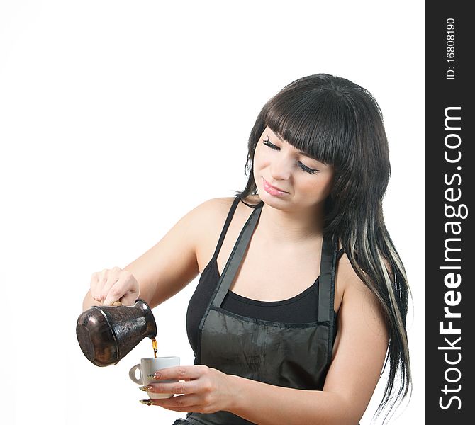 Women fill coffee cup from a cezve