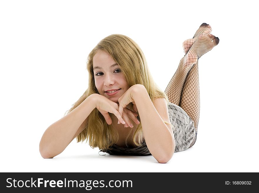 Pretty teenager laying on the floor, isolated on white background