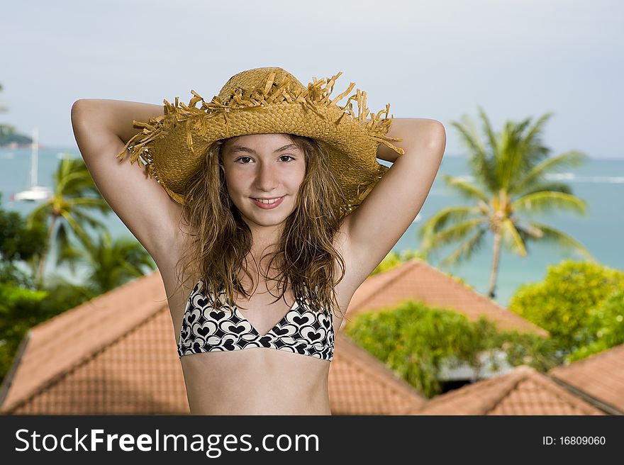 Happy teenager in front of a holiday resort