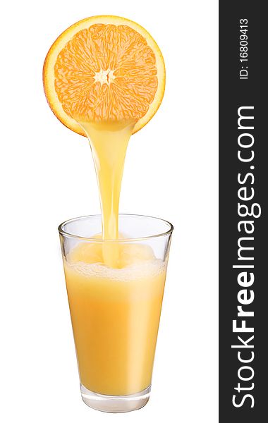 Juice flowing from orange into the glass. Juice flowing from orange into the glass.
