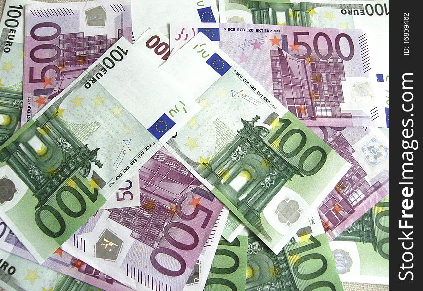 Background of scattered 100 and 500 euro banknotes. Background of scattered 100 and 500 euro banknotes