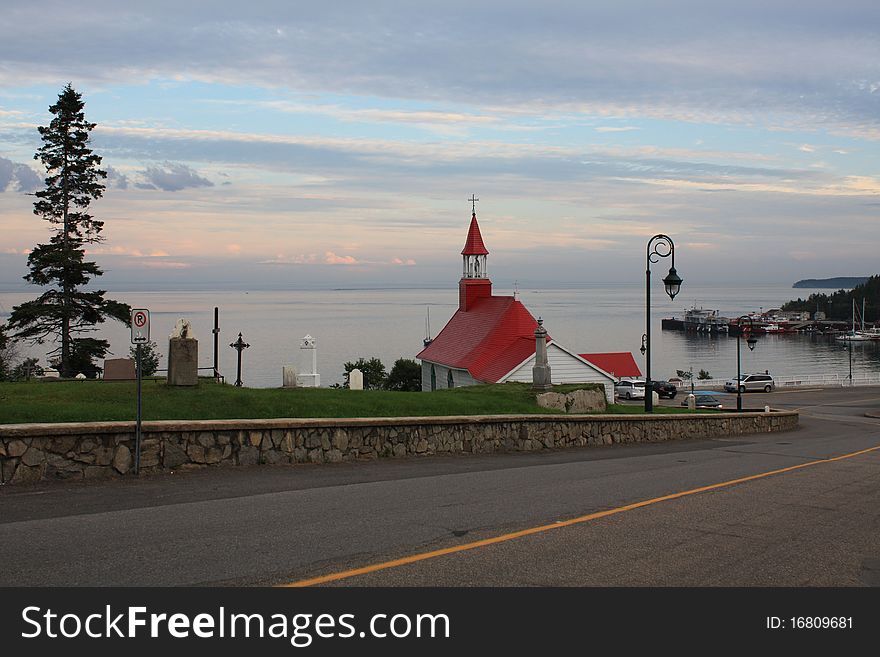 Church and sea at the sunset, Tadoussac, Quebec