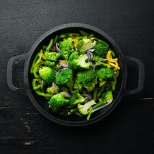 Green Vegetables Stewed In A Frying Pan. Royalty Free Stock Images