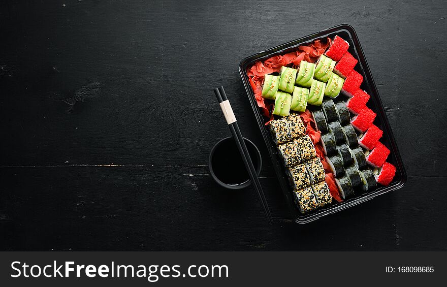 Food Delivery, Sushi Rolls. Set Of Sushi In A Plastic Box. Japanese Traditional Cuisine.