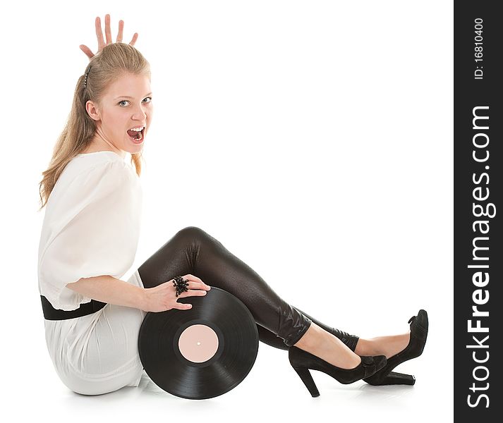 Young girl with a vinyl record on white background