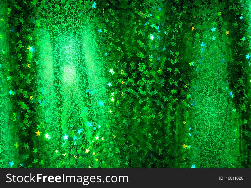 An abstract starry green background.