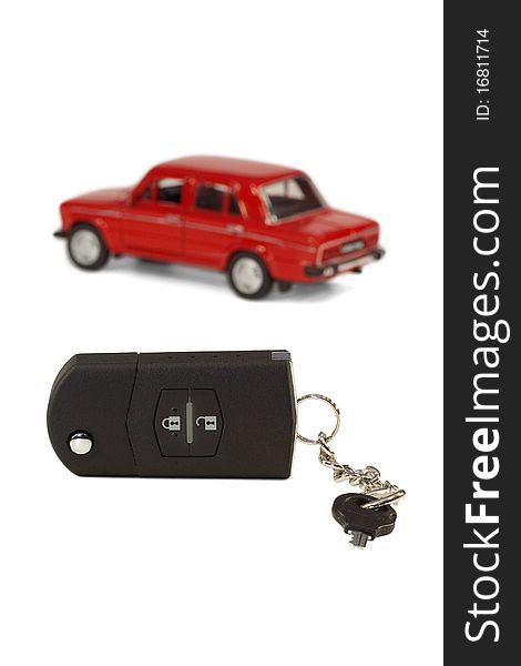 A set of car keys on the background of a model car. A set of car keys on the background of a model car