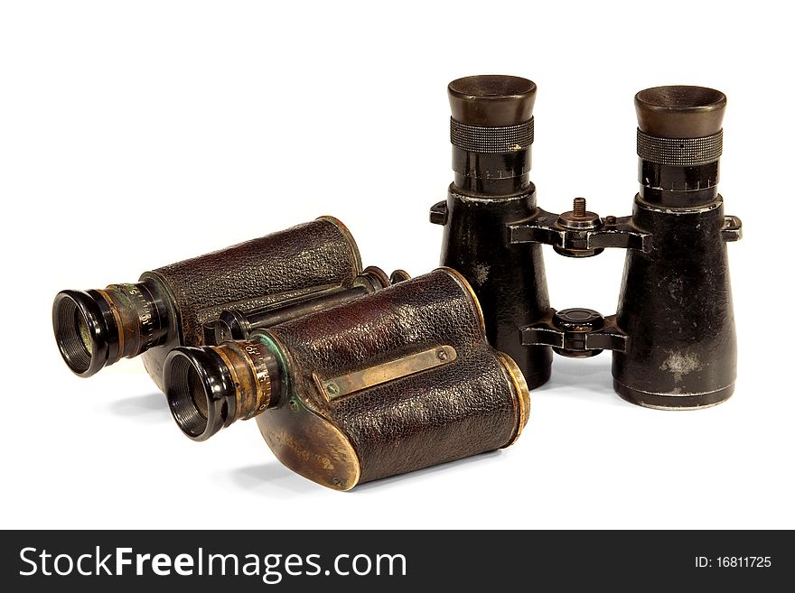 Two old binoculars, optical instruments for observation at a distance. Two old binoculars, optical instruments for observation at a distance