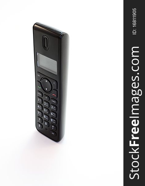 Modern digital black cordless phone at the white background. Modern digital black cordless phone at the white background
