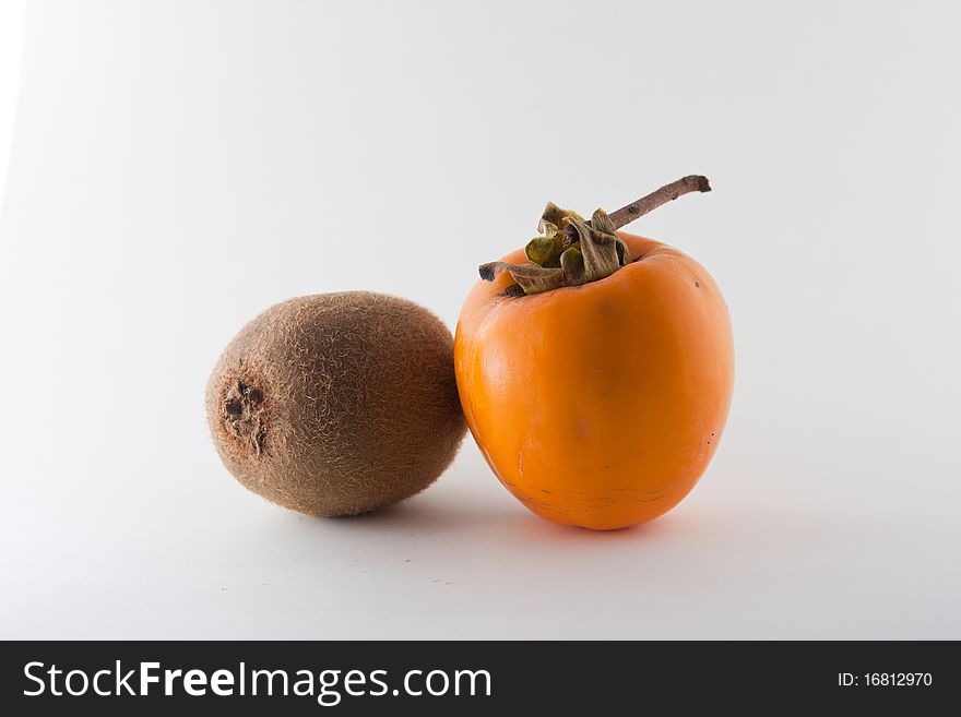 Two good autumnal fruit with white background. Two good autumnal fruit with white background