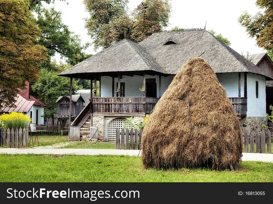 Vintage house in autumn with a stack on the front-yard