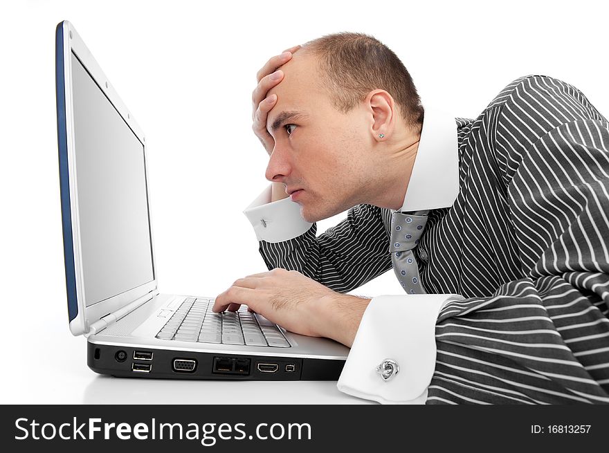 Young businessman working with laptop