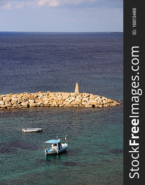 Fishing boats and lighthouse