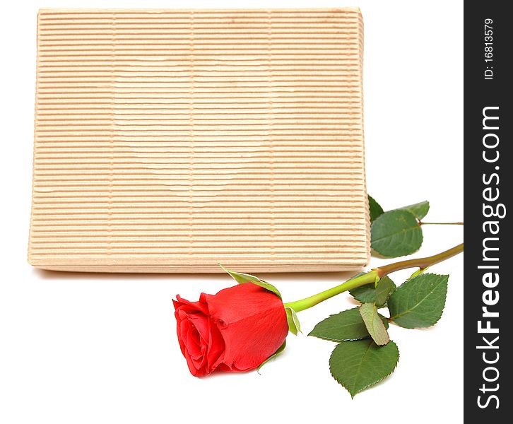 Red rose and gift box on white background