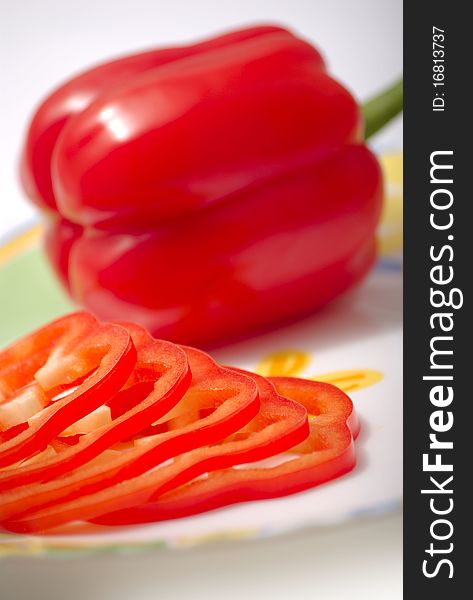 Paprica (Bulgarian pepper), sliced on a plate. Paprica (Bulgarian pepper), sliced on a plate.
