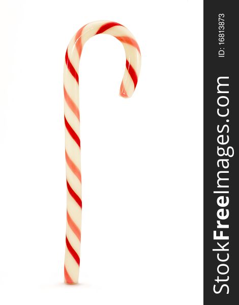 Red and pink striped candy cane isolated over white. Red and pink striped candy cane isolated over white