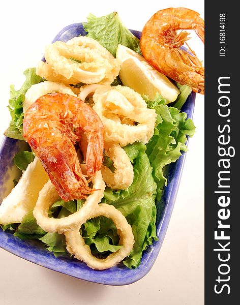 Fried calamari rings and shrimp nestled on a bed of lettuce. Fried calamari rings and shrimp nestled on a bed of lettuce